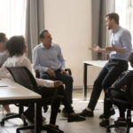Leader Collaborating Side by Side With Team Members