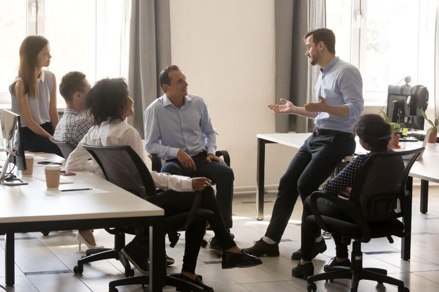 Leader Collaborating Side by Side With Team Members